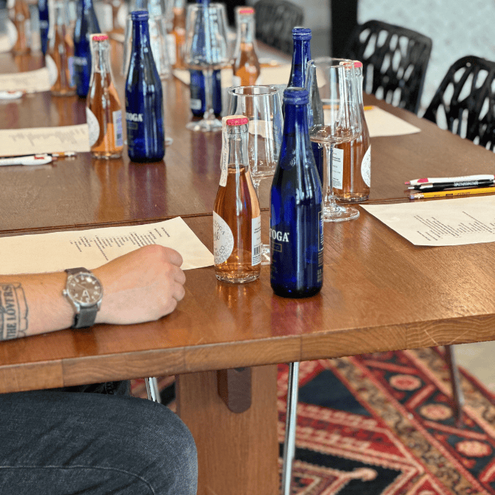 a board room table set for a corporate meeting at the winery