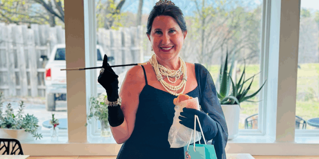 Birthday Girl celebrating her 50th birthday dressed up for a Pearl's and Prosecco Party